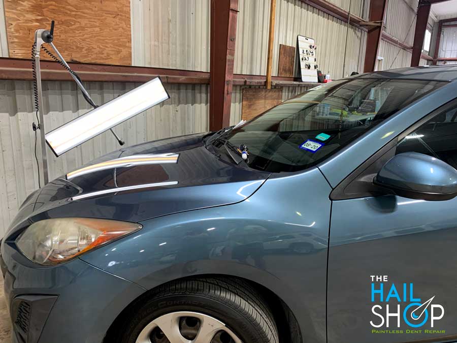 Blue Sedan Auto Hail Repair in San Antonio